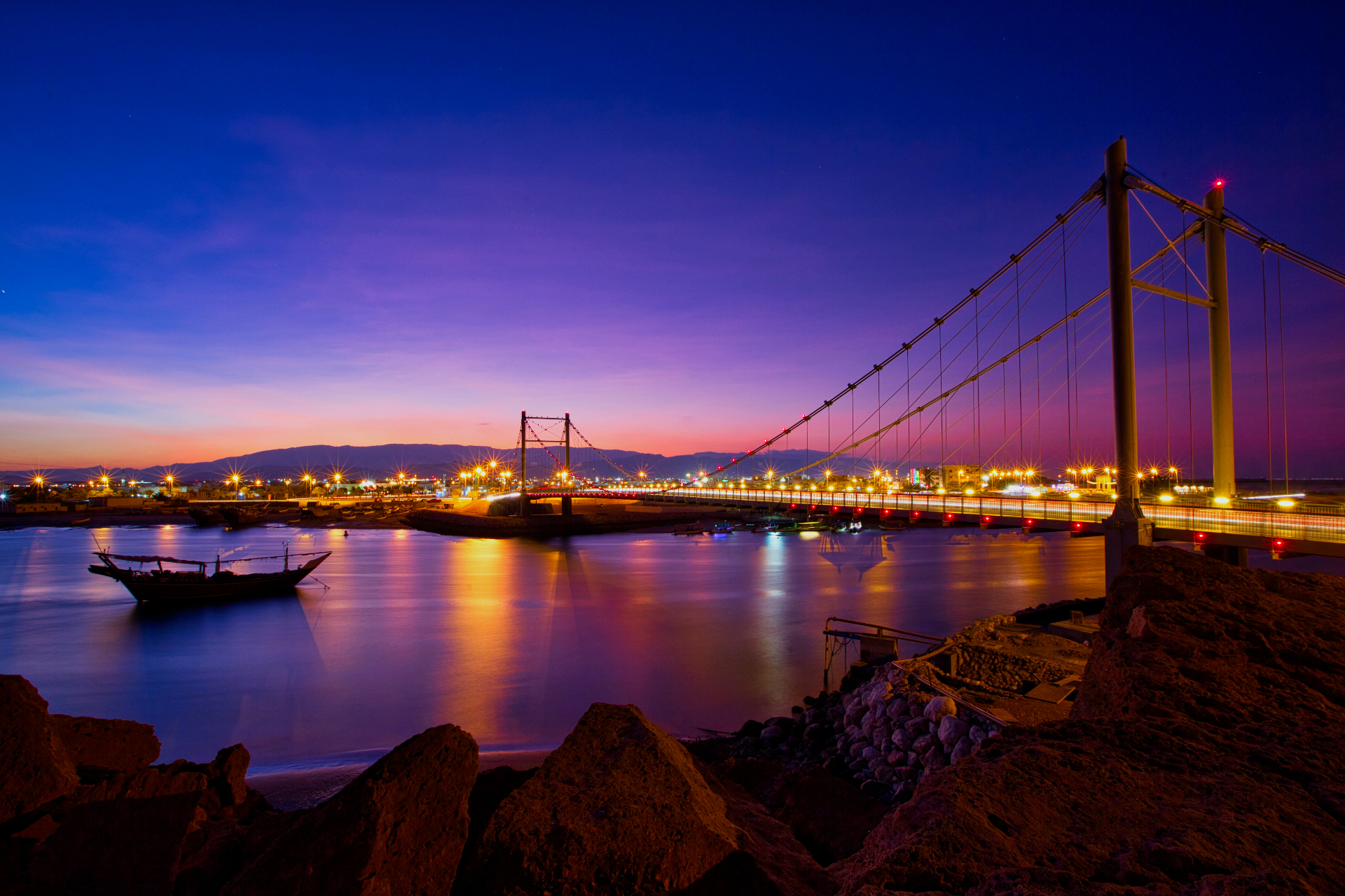 Khor Fakkan corniche at dusk — gateways of the Sultanate